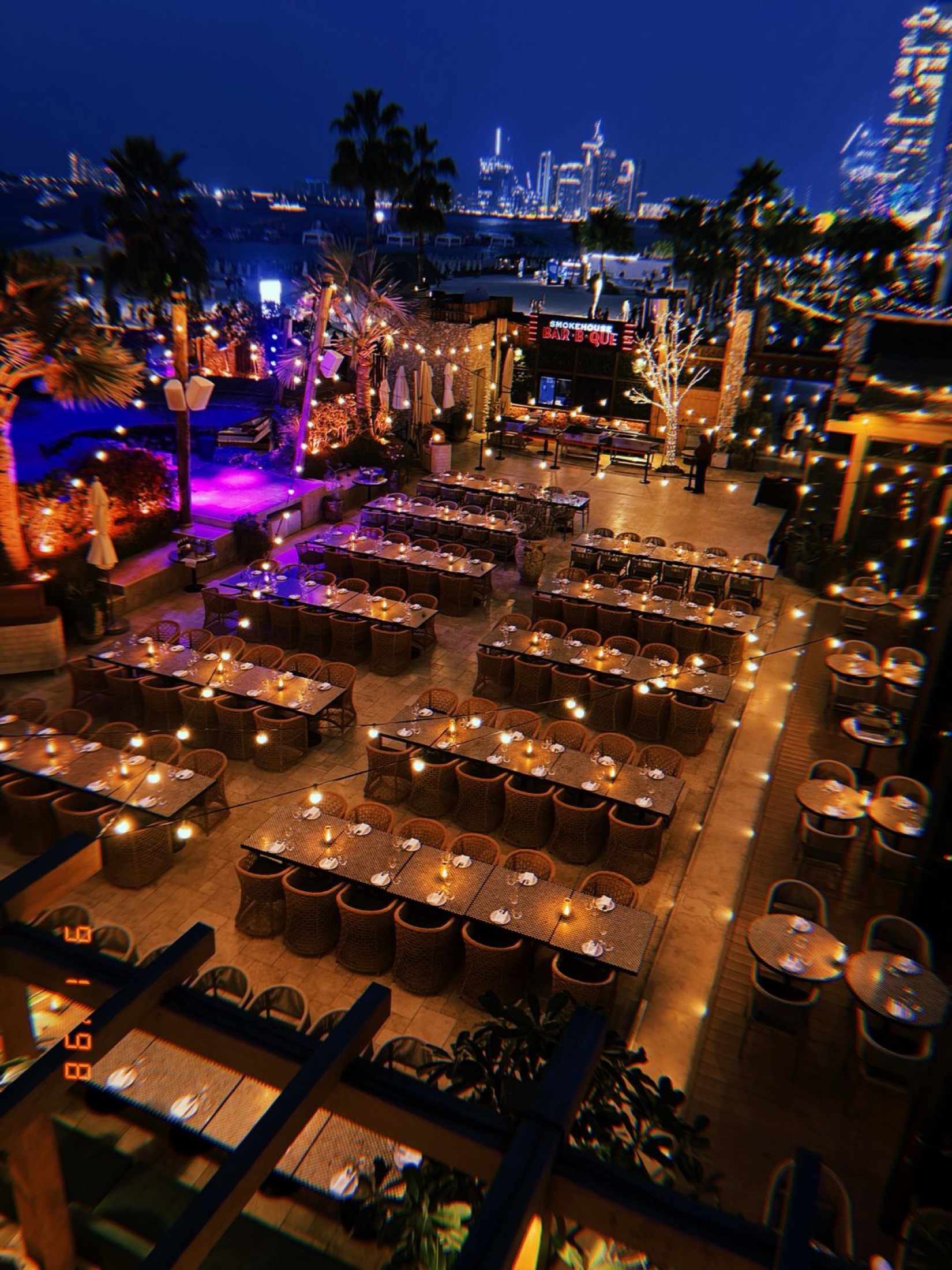 Large private dinner set-up overlooking the Dubai skyline